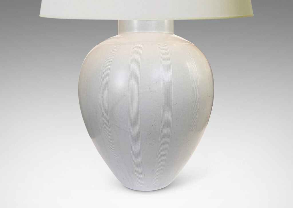 Gallery BAC tapered ovoid form with subtle relief meridian bands, glazed in a soft ivory