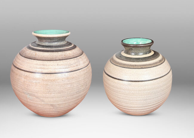 Gallery BAC plump globe forms with sprouting mouths, glazed in craquel greige, with charcoal gray graduated bands and turquoise interiors