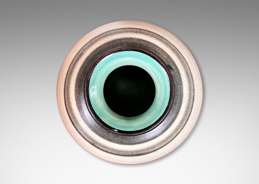 Gallery BAC plump globe forms with sprouting mouths, glazed in craquel greige, with charcoal gray graduated bands and turquoise interiors