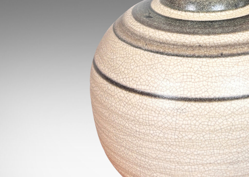 Gallery BAC plump globe forms with sprouting mouths, glazed in craquel greige, with charcoal gray graduated bands and turquoise interiors