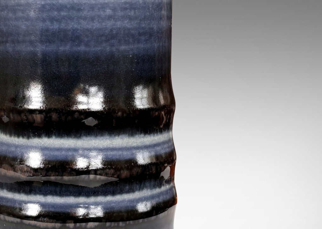 Gallery BAC cylindrical forms articulated with raised rings and glazed with graduations of blue tones