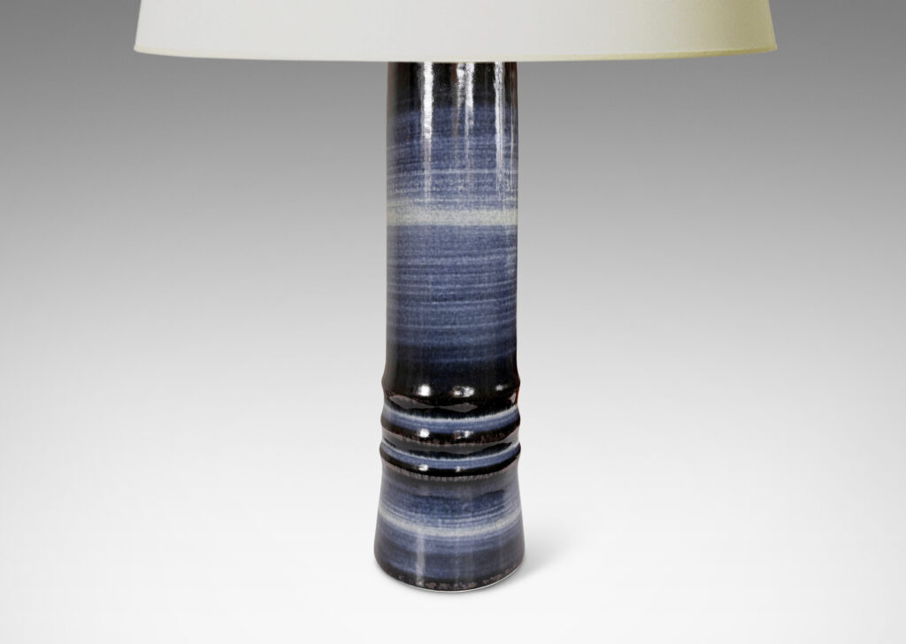 Gallery BAC cylindrical forms articulated with raised rings and glazed with graduations of blue tones