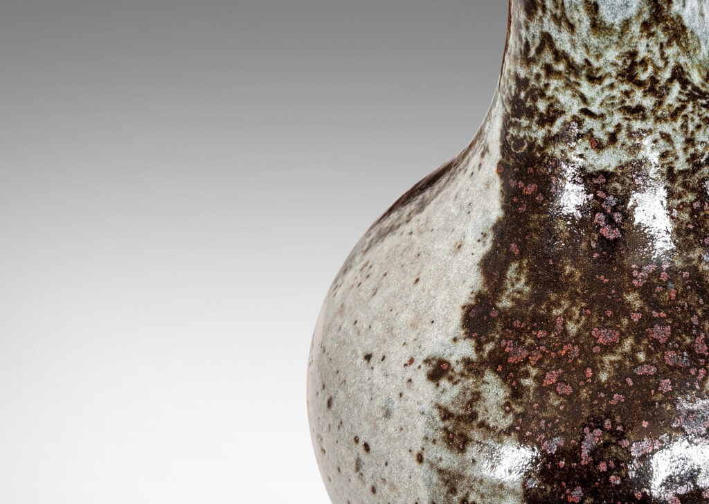 Gallery BAC organically modeled pawn / gourd form, glazed in a shiny dappled pale gray with black-red luster areas