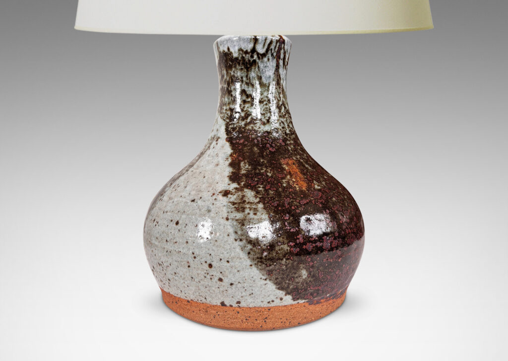 Gallery BAC organically modeled pawn / gourd form, glazed in a shiny dappled pale gray with black-red luster areas