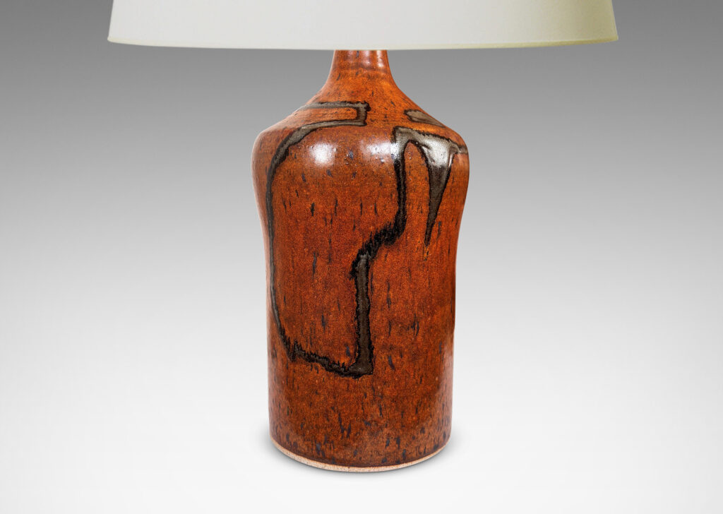 Gallery BAC cylindrical form with swelling shoulders and sprouting neck, glazed in rust-brown with abstract design in gray-red luster
