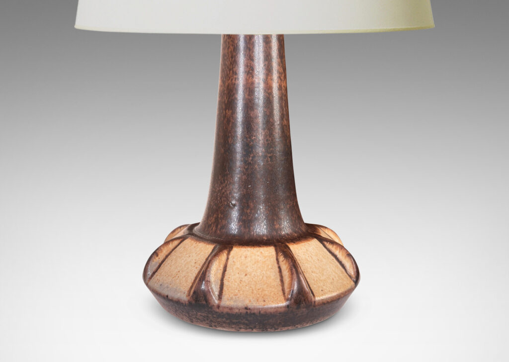 Gallery BAC ow angled and notched form with tall neck, glazed in dark brown with beige