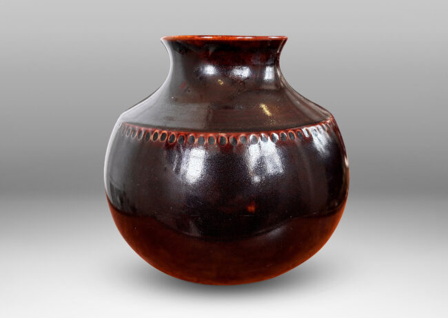Gallery BAC demi-globe form, with coved neck, wide mouth, and carved beanded detail, glazed in a semi-shine ganache brown