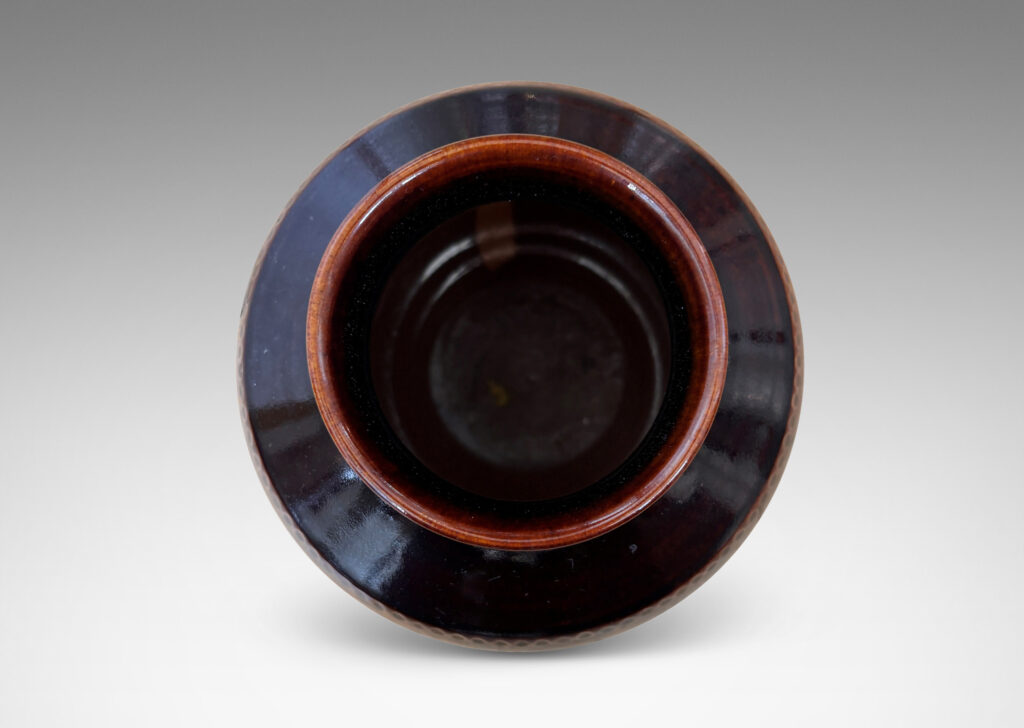 Gallery BAC demi-globe form, with coved neck, wide mouth, and carved beanded detail, glazed in a semi-shine ganache brown