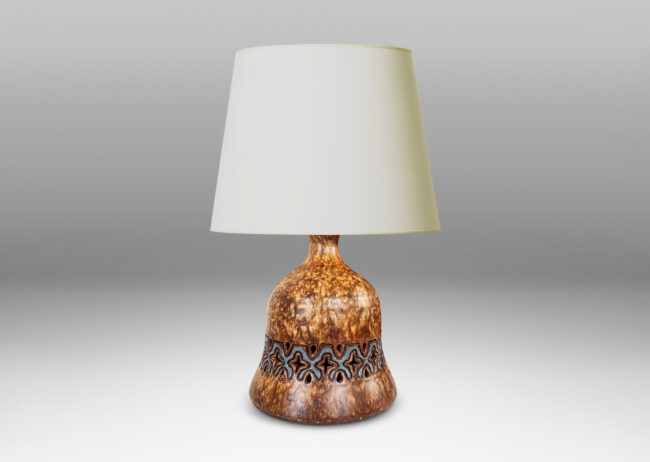 Gallery BAC undulating bell form with carved and openwork ornamental band, glazed in dappled darker overnighter browns, with blue accents