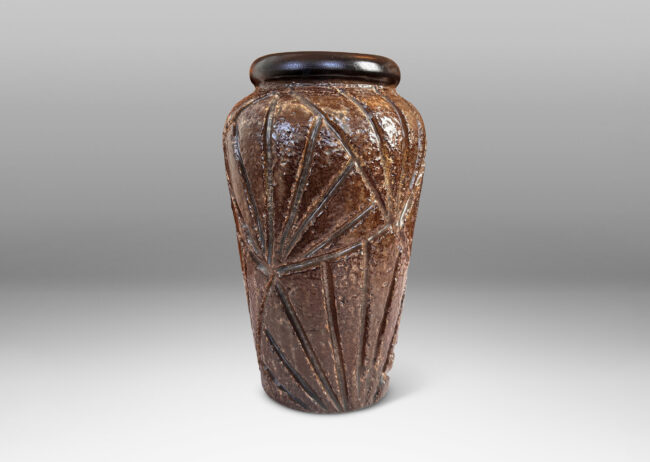 Gallery BAC large tapered form with rugged carved palmate pattern and smooth bead lip, glazed in medium and dark brown