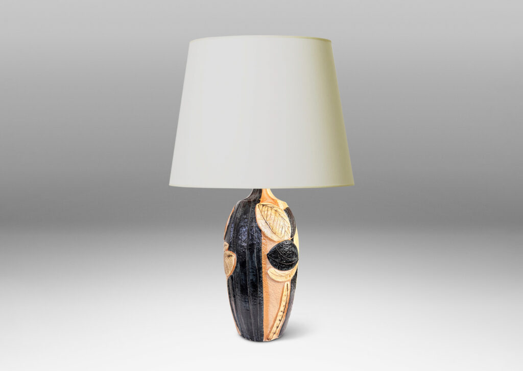 Gallery BAC tall swelling forms with applied relief abstract foliage and coved necks, glazed in ivory, tan, and bluish-black