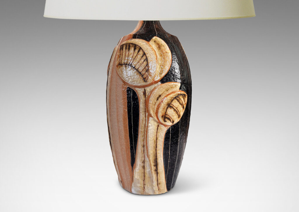 Gallery BAC tall swelling forms with applied relief abstract foliage and coved necks, glazed in ivory, tan, and bluish-black