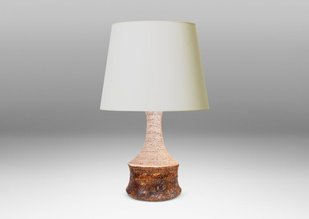 Gallery BAC cove-sided drum form with spouting neck, in textured grog ceramic, glazed in matte ivory and brown
