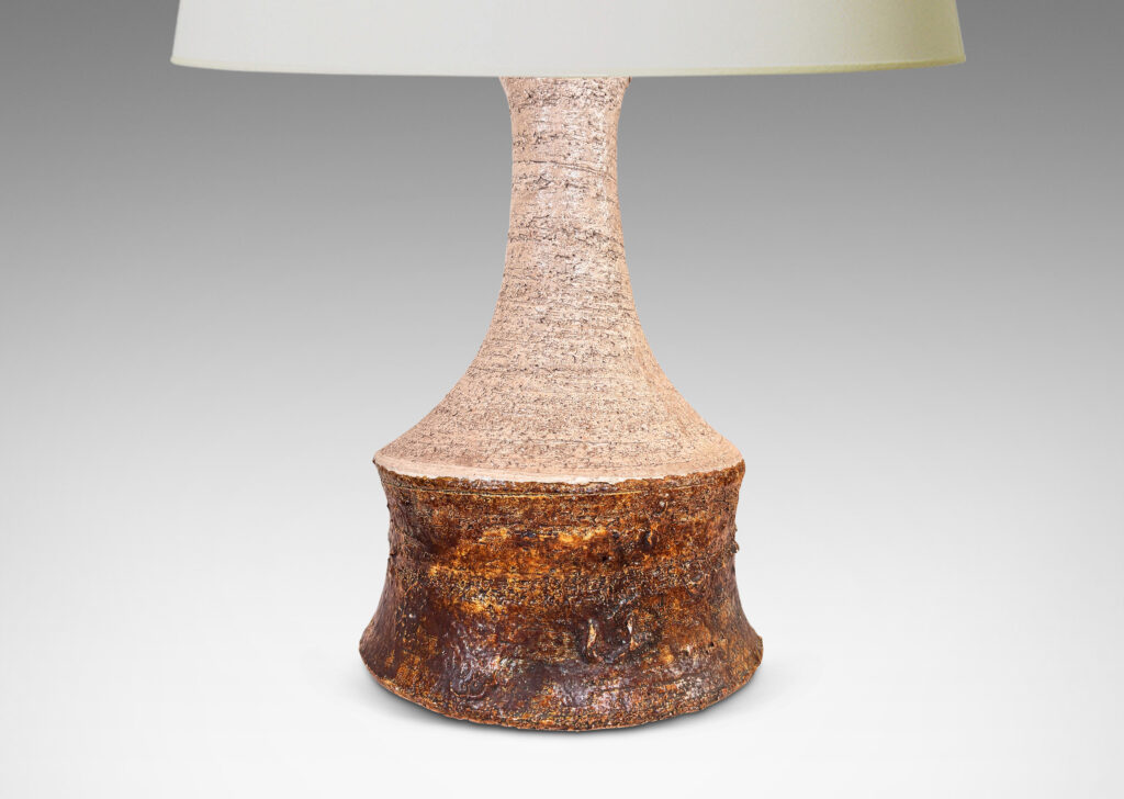 Gallery BAC cove-sided drum form with spouting neck, in textured grog ceramic, glazed in matte ivory and brown