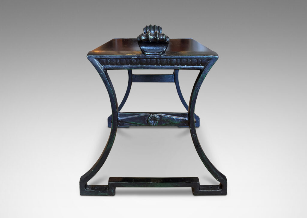 Gallery BAC having muscular lines, classical motifs, and shell handles, featuring verdigris green-black frames; painted cast iron and wood