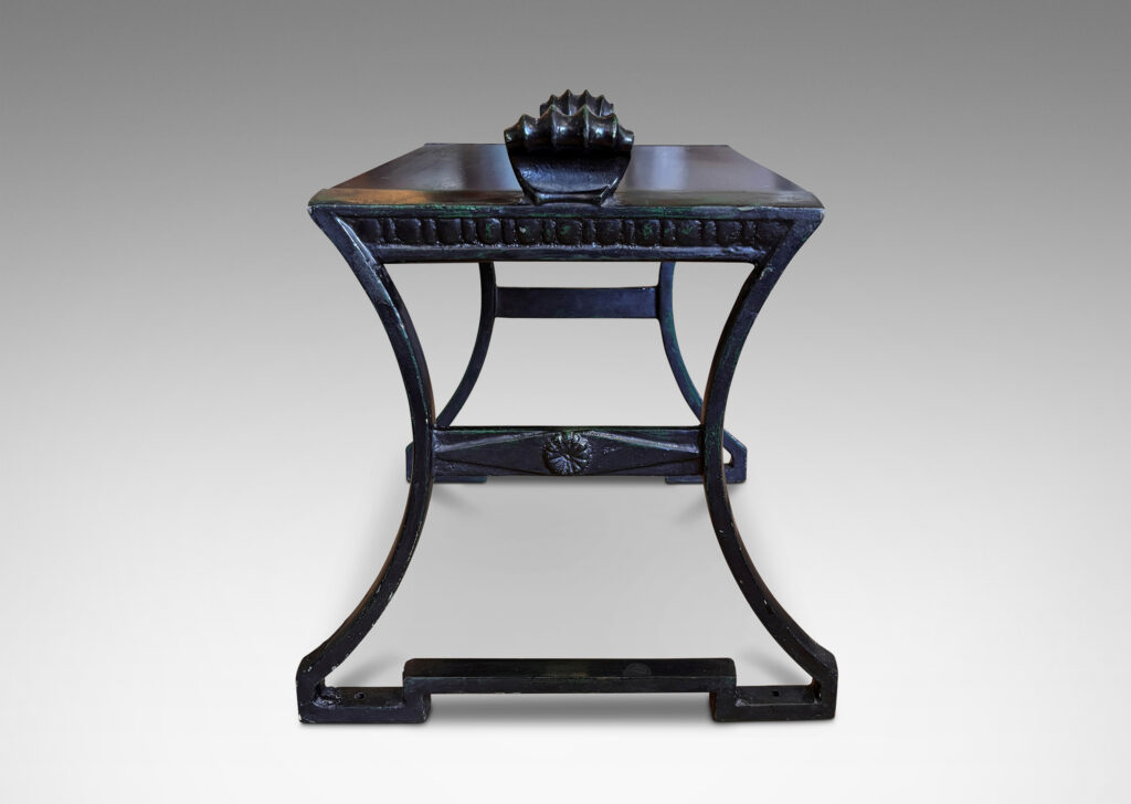 Gallery BAC having muscular lines, classical motifs, and shell handles, featuring verdigris green-black frames; painted cast iron and wood