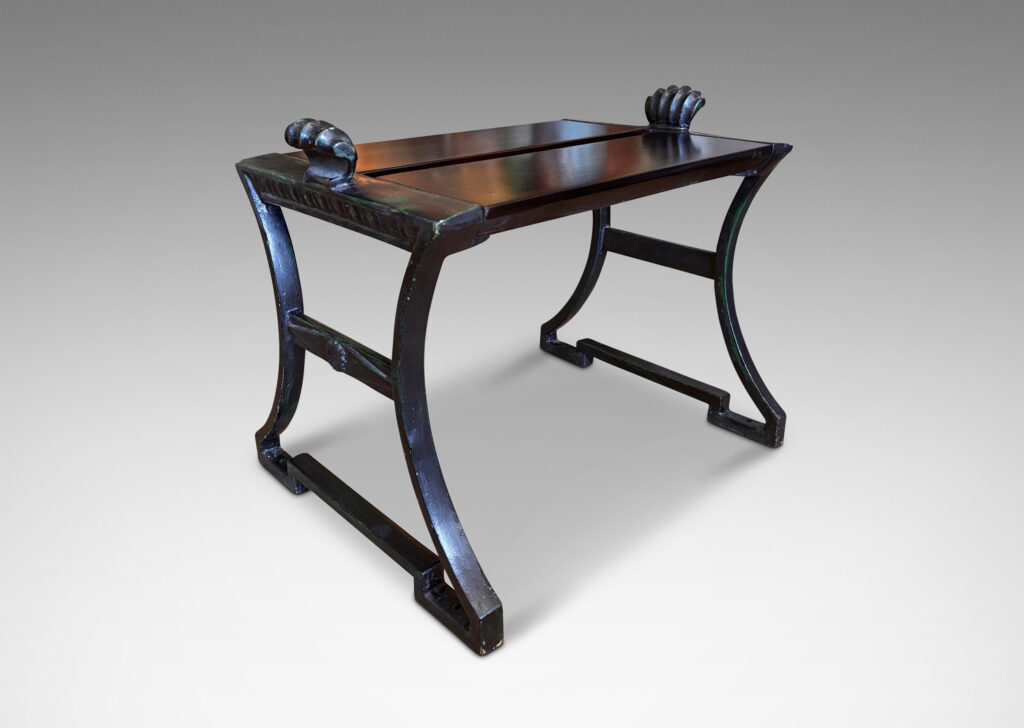 Gallery BAC having muscular lines, classical motifs, and shell handles, featuring verdigris green-black frames; painted cast iron and wood