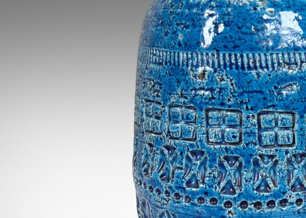 Gallery BAC ovoid form with tapered top, ornamented with impressed geometric motifs, glazed in a saturated cerulean blue