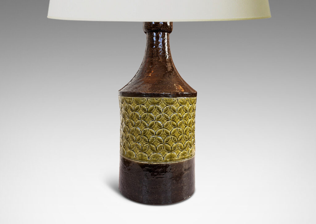 Gallery BAC having a cylindrical form with coved neck and geometric reliefs, glazed in olive green and dark brown