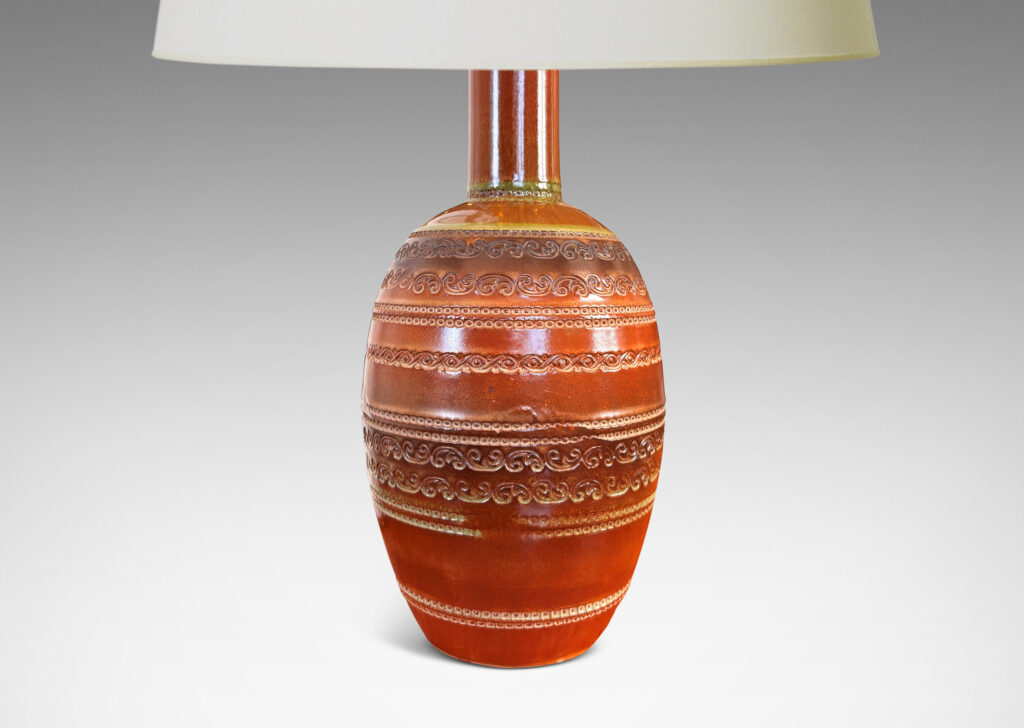 Gallery BAC ovoid form with neck, impressed with bands of ornaments evoking tooled leather, glazed in semi-shine brown, with darker brown and green accents