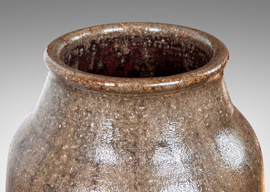 Gallery BAC ovoid form with coved neck, glazed in shiny oxblood burgundy and semi-shine gray-brown