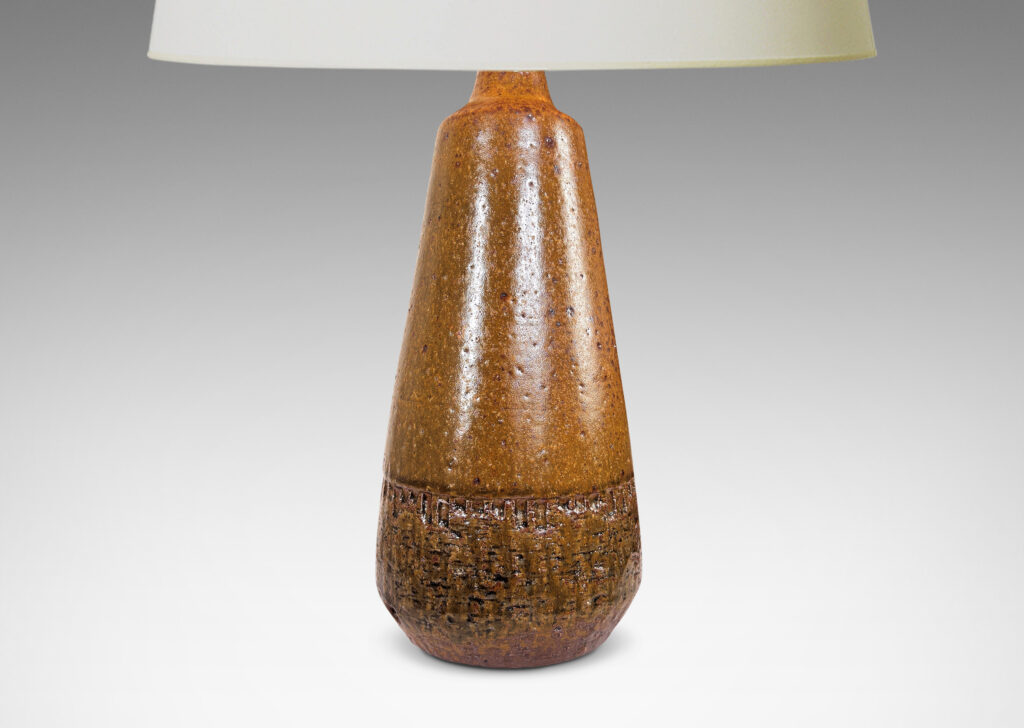 Gallery BAC conical form with rounded edge over a reveal foot, and textured base, glazed in a greenish mustard brown