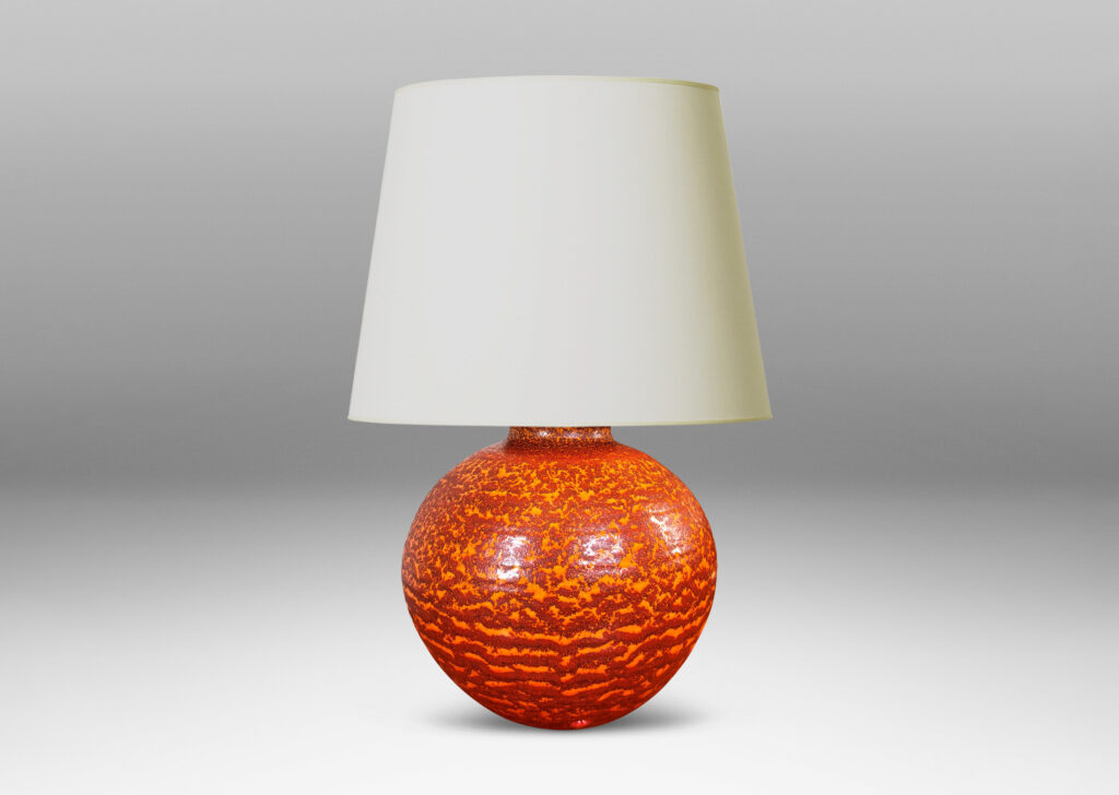 Gallery BAC plump globe form, glazed in a mottled burnt orange dapple over lighter orange “Korall” (coral) glazing