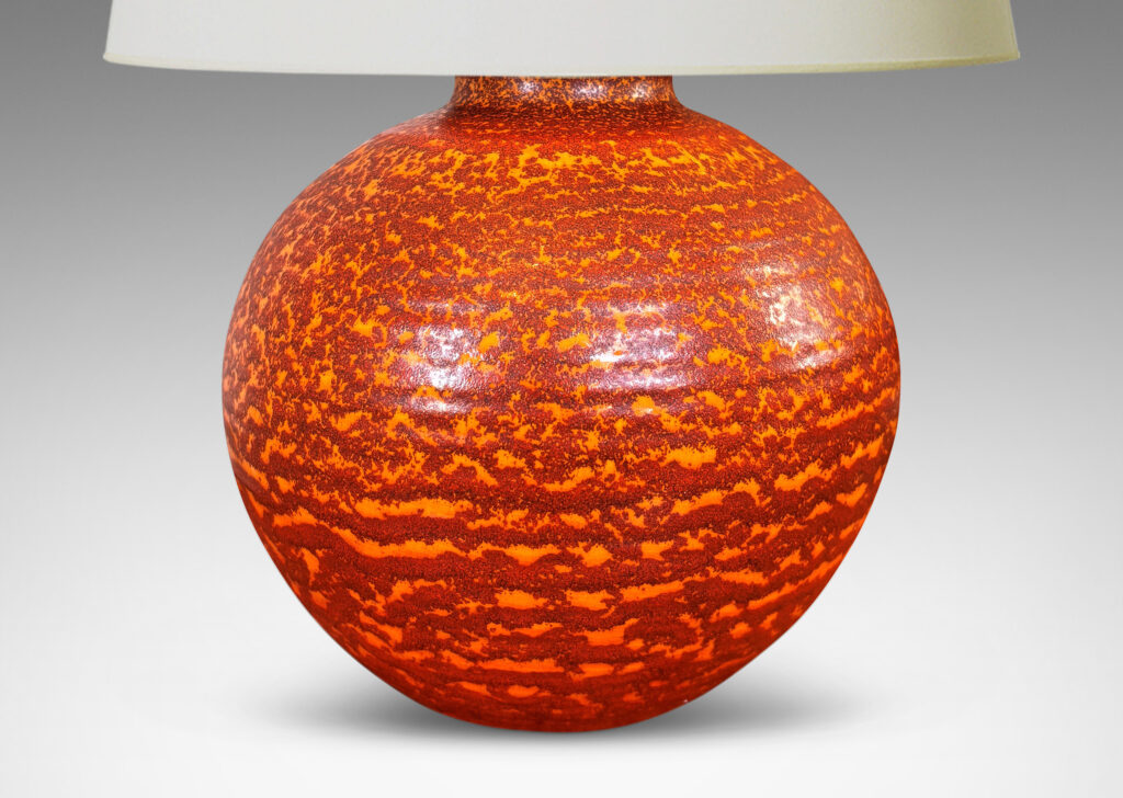 Gallery BAC plump globe form, glazed in a mottled burnt orange dapple over lighter orange “Korall” (coral) glazing