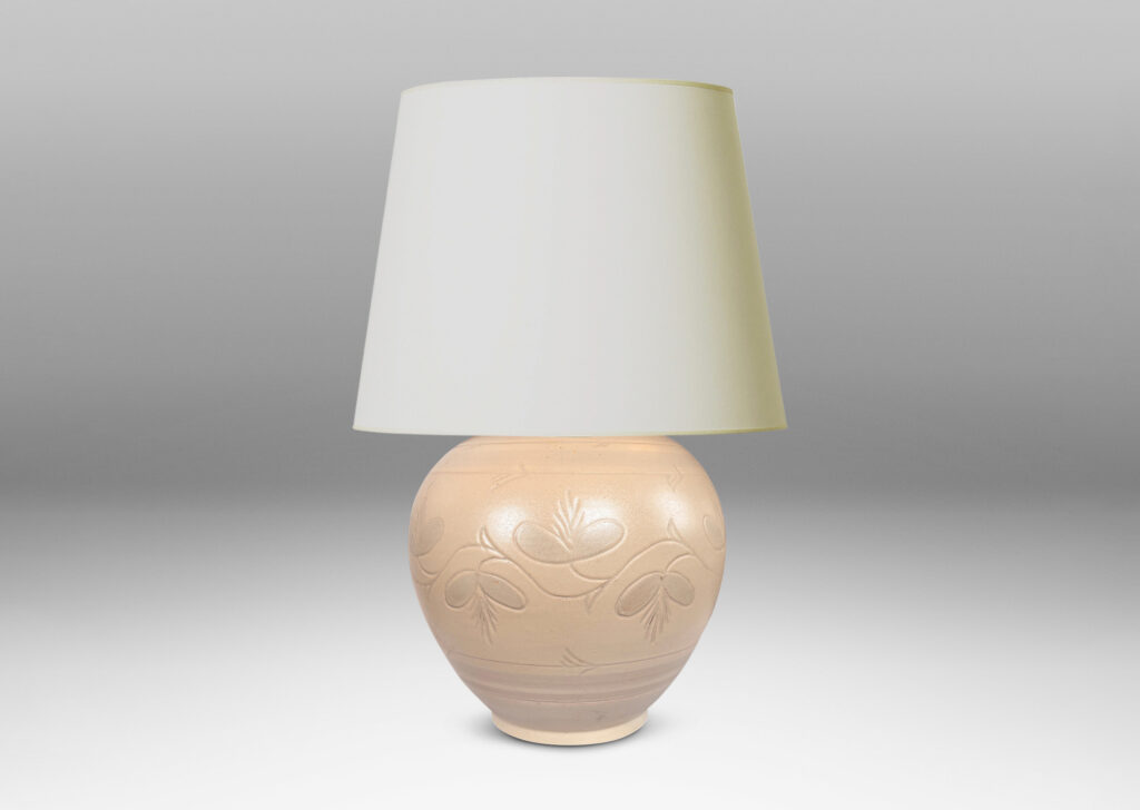 Gallery BAC tapered globe form with carved pinstripe bands and folk style floral ornaments, glazed in an eggshell ivory