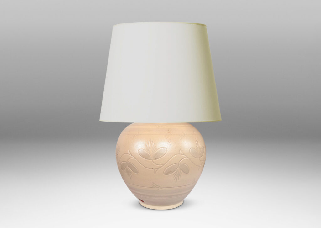 Gallery BAC tapered globe form with carved pinstripe bands and folk style floral ornaments, glazed in an eggshell ivory