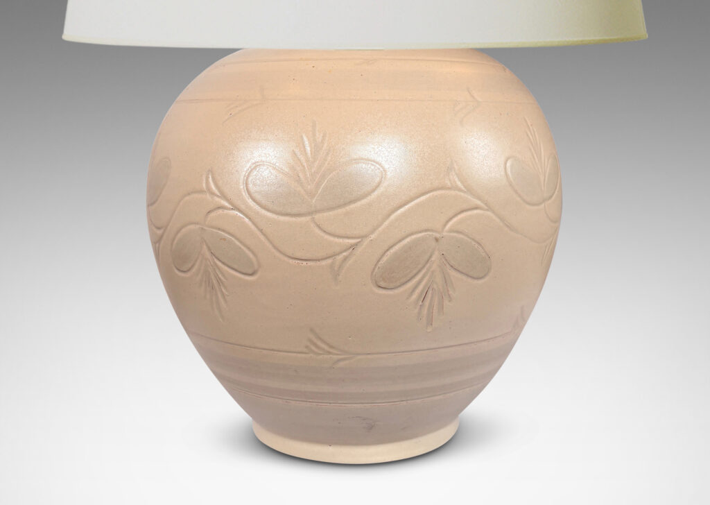 Gallery BAC tapered globe form with carved pinstripe bands and folk style floral ornaments, glazed in an eggshell ivory