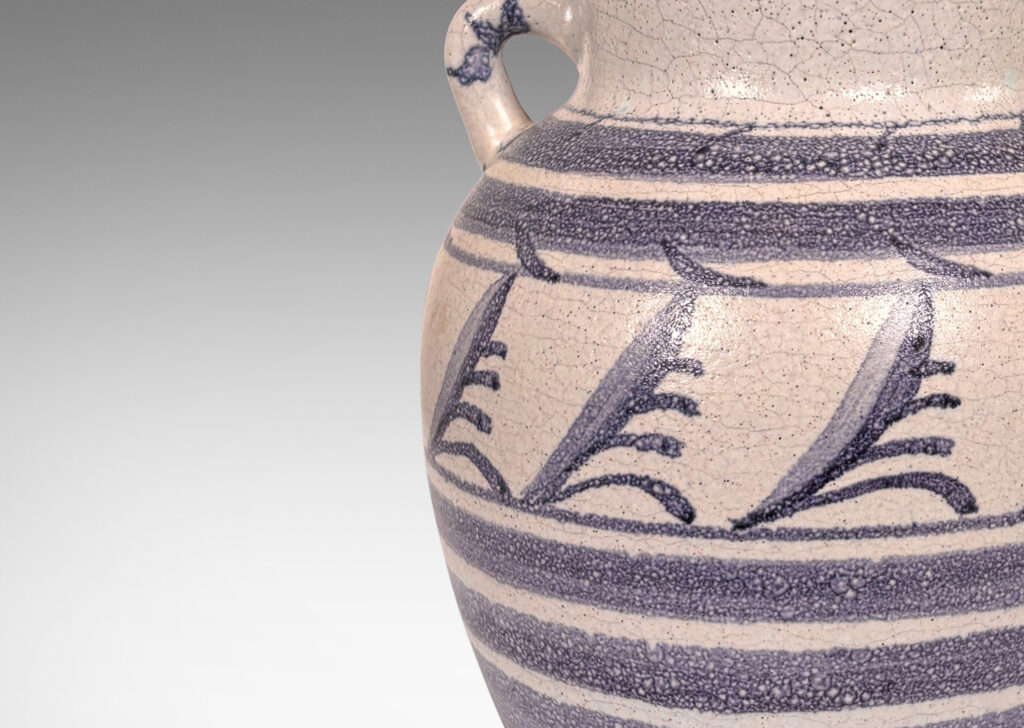 Gallery BAC tapered urn for with wide outstretching mouth and loop handels, in pale craquel gray overglazed with blue-purple bands and foliate designs