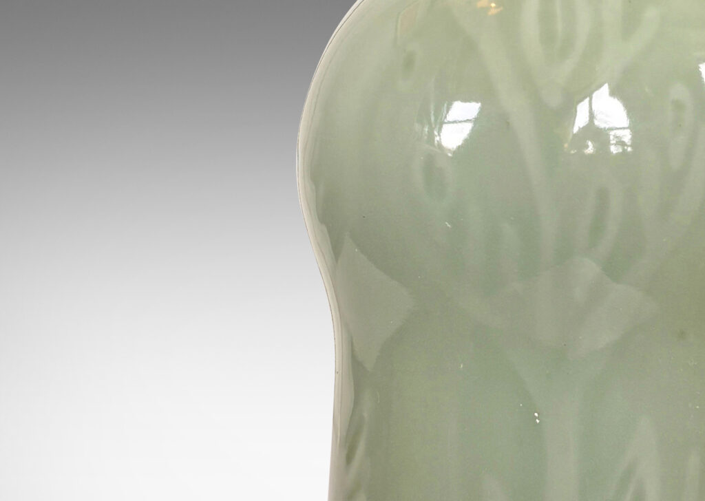 Gallery BAC gourd form with carved floral ornaments, glazed in an ethereal thick celadon