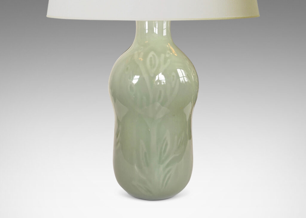 Gallery BAC gourd form with carved floral ornaments, glazed in an ethereal thick celadon