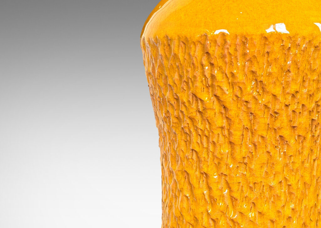 Gallery BAC sinuously modeled profile with carved texture and saturated yellow glaze