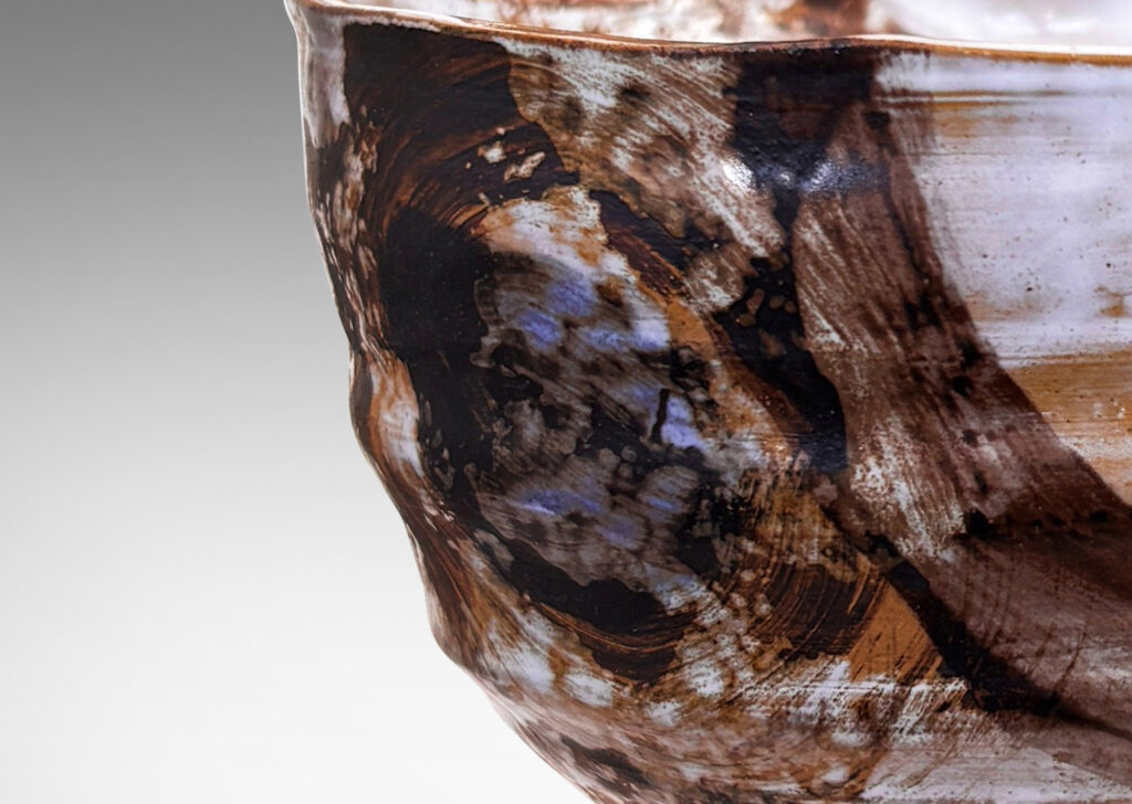 Gallery BAC thin, ridged form, glazed in flowing brown and white over tan