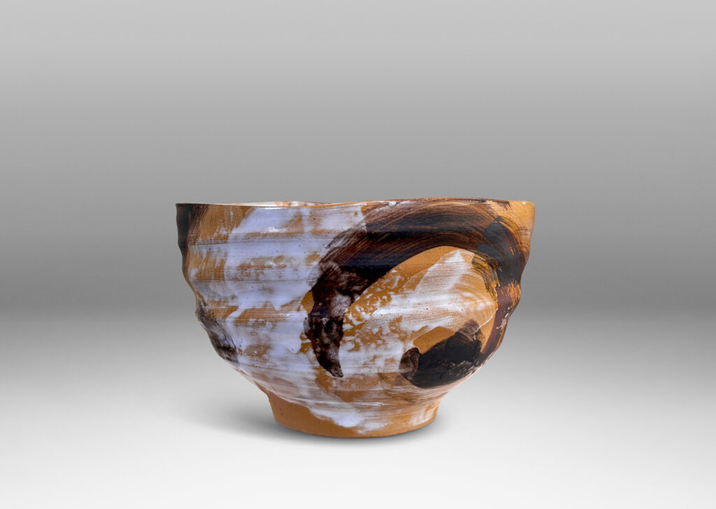 Gallery BAC thin, ridged form, glazed in flowing brown and white over tan