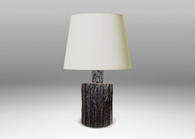 Gallery BAC cylindrical form with carved bark-evoking texture, glazed in a dark black-brown