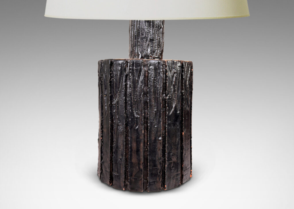 Gallery BAC cylindrical form with carved bark-evoking texture, glazed in a dark black-brown