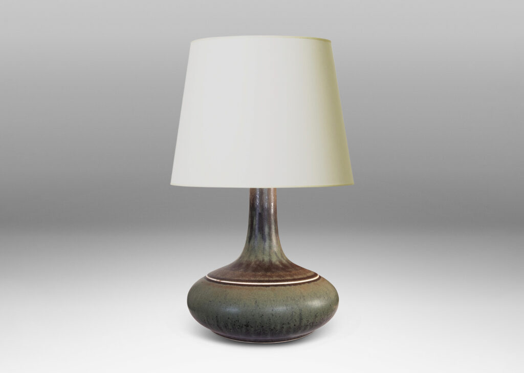 Gallery BAC decanter-like form with a wide compressed base and sprouting neck; glazed in a flowing dark green tones