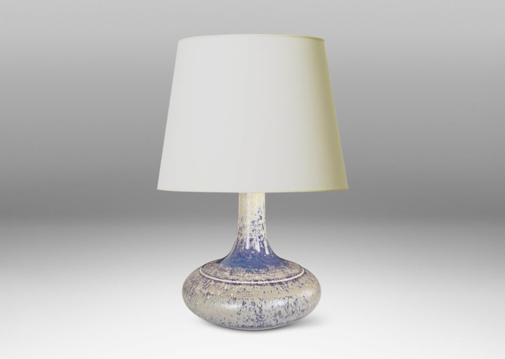 Gallery BAC decanter-like form with a wide compressed base and sprouting neck; glazed in purple and pale gray