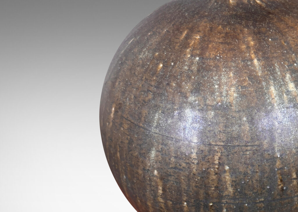 Gallery BAC globe form with slender spouting neck, glazed in flowing dark green