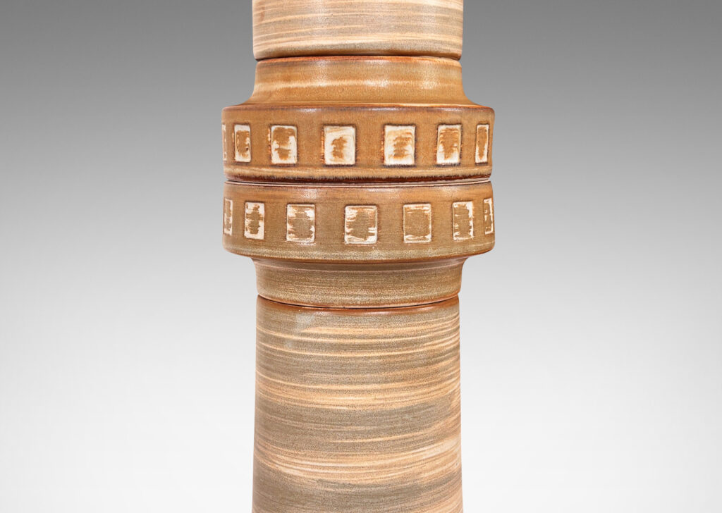 Gallery BAC tall cylindrical form with flanged ends and floating band with relief square motif