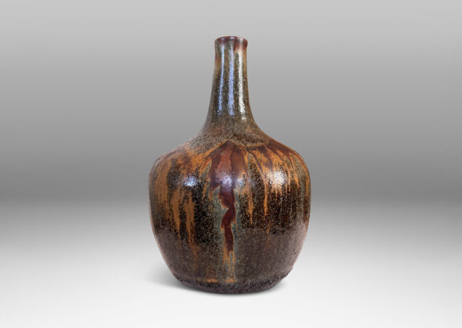 Gallery BAC apple-like form with tall slender neck, glazed in flowing matte light and dark brown over shiny black and gray