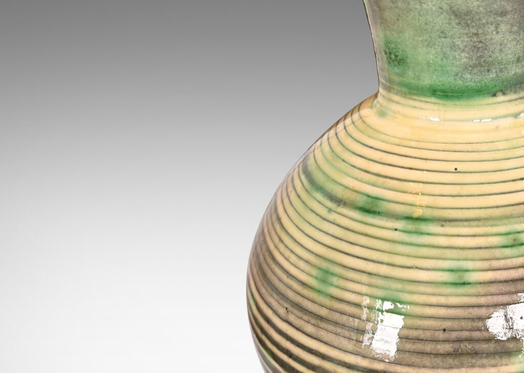 Gallery BAC angled globe form with wide neck, glazed in green stripes and neck over ivory