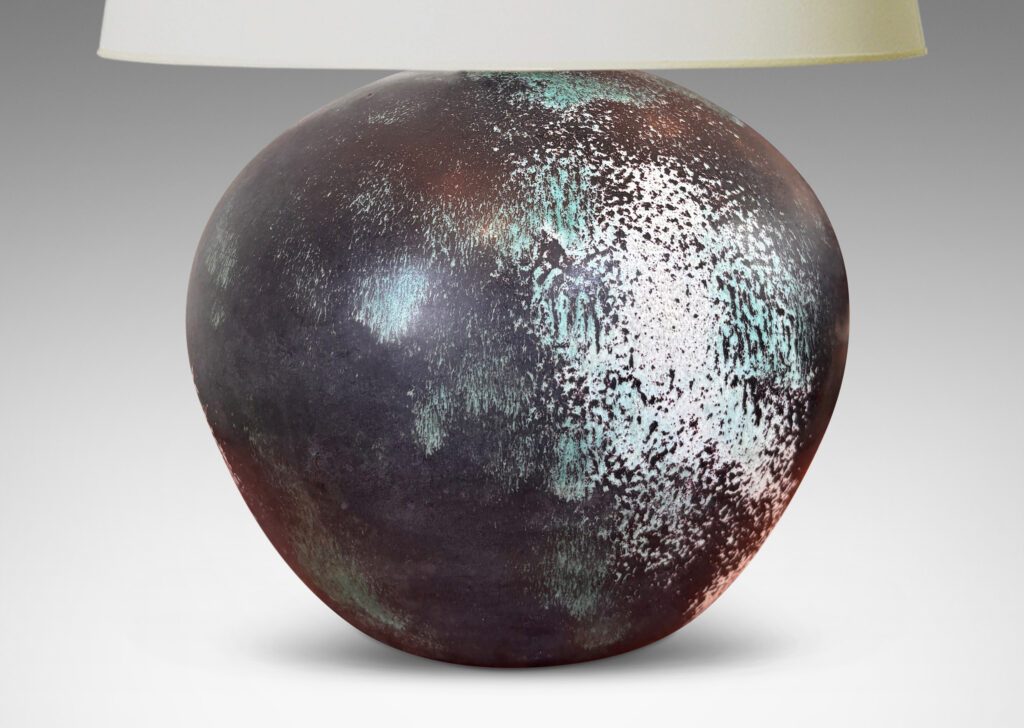 Gallery BAC plump globe form, glazed in a matte black with airy blushes of white and blue-green