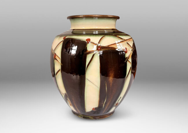 Gallery BAC globe form with angled shoulder and outstretched mouth with brass rim, decorated with a shiny glaze geometric design