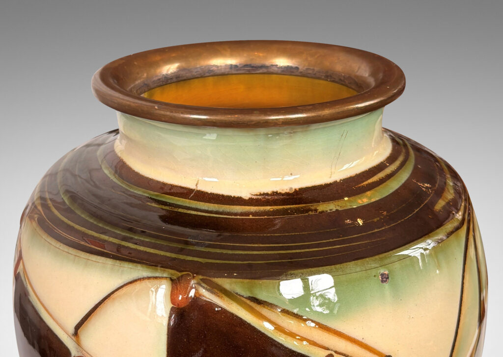 Gallery BAC globe form with angled shoulder and outstretched mouth with brass rim, decorated with a shiny glaze geometric design
