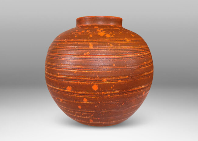 Gallery BAC globe form with carved pinstripe banding, glazed in matte orange-brown and orange