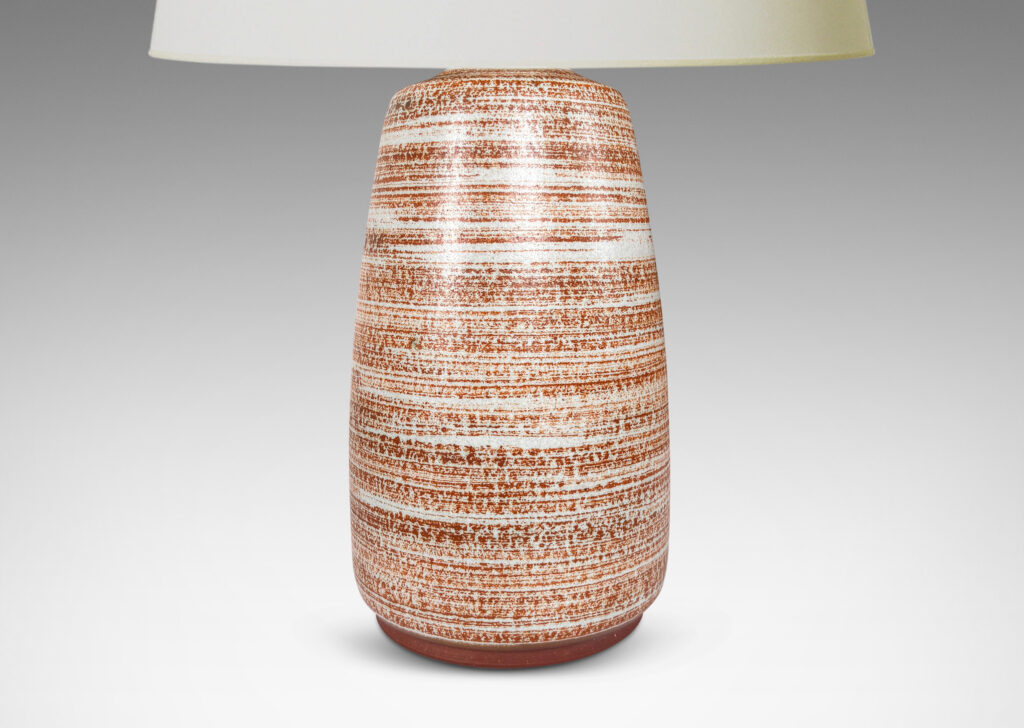 Gallery BAC organically modeled cylindrical form glazed in a warm brown striae over pale gray